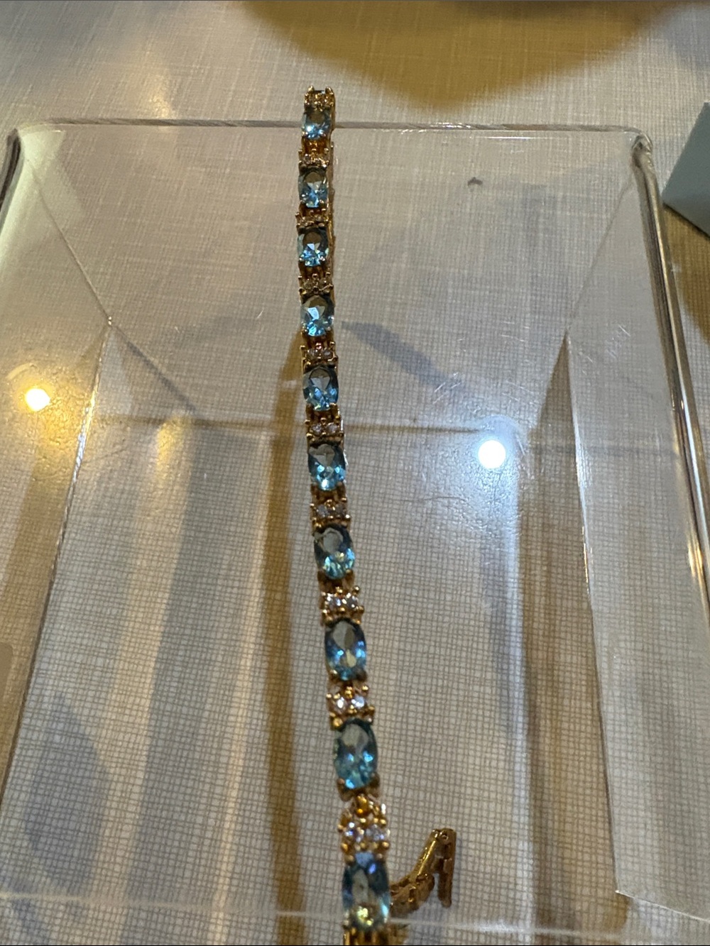 Gold and simulated, aqua marina birthstone Bracelet march